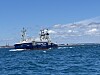 Det blå fartøyet Reach Remote 2 fra Reach Subsea seiler på åpent hav under blå himmel.